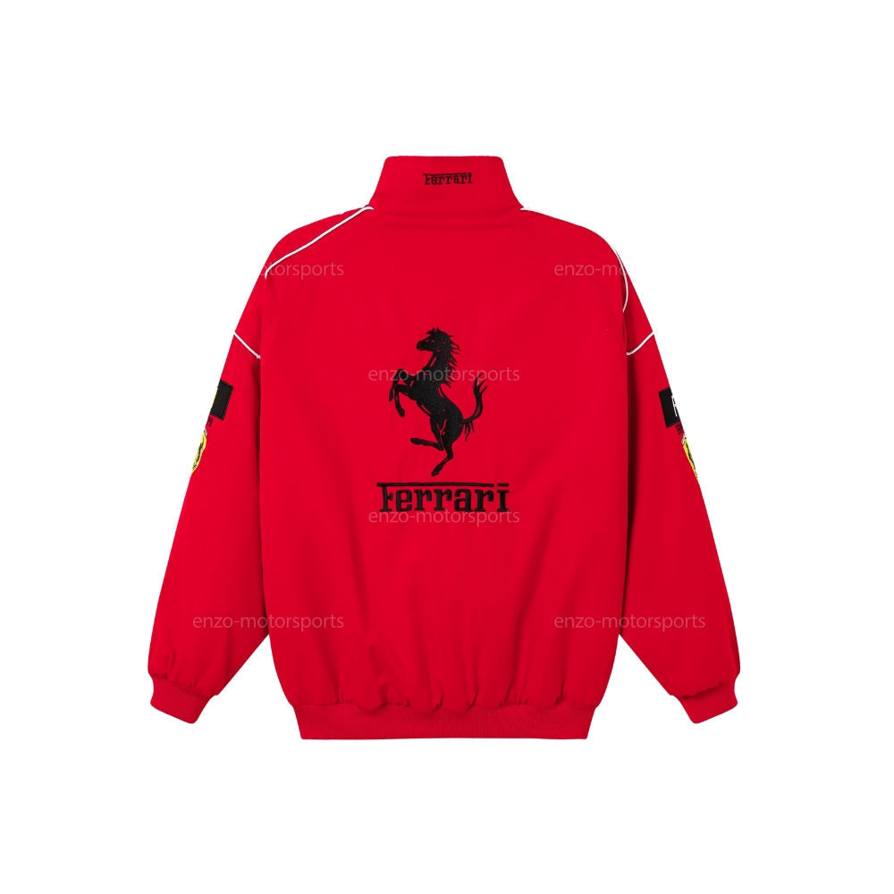 Embroidered Ferrari bomber jacket honouring Michael Schumacher, with sponsor-style patches across the sleeves. A classic motorsport jacket for fans and collectors.