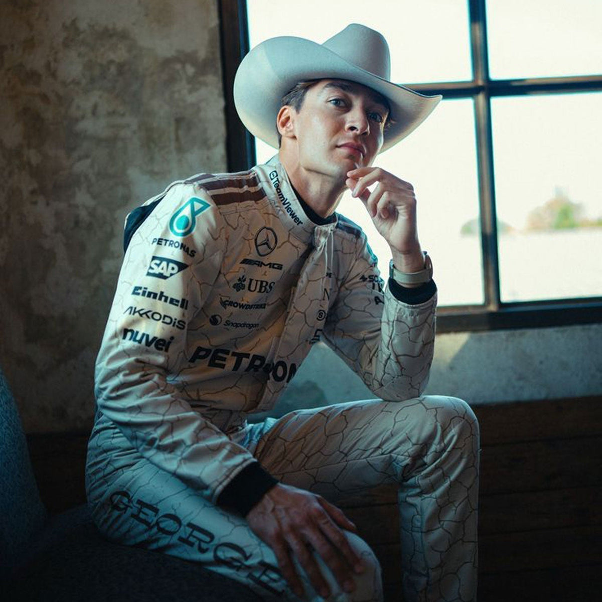 Mercedes race suit worn in George Russell style, displaying the fitted one-piece cut with elasticated cuffs and a soft collar. A comfortable racing jumpsuit for F1 fans, kart track days and themed parties.