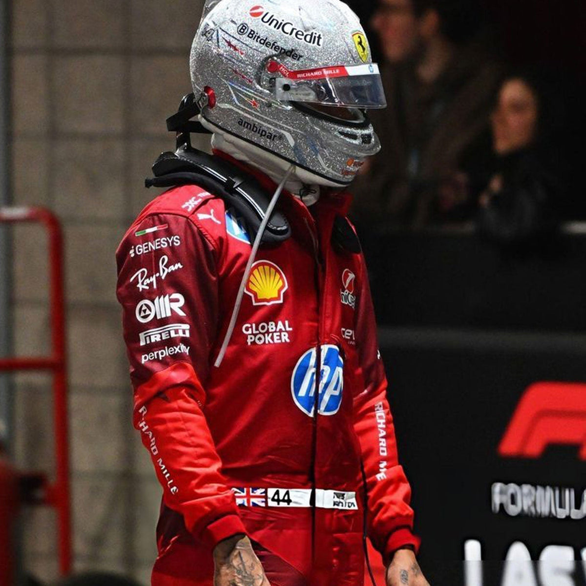 Lewis Hamilton 2025 fan race suit, laid out to show the printed racing number, belt panel and stretch inserts. Ideal F1 fan attire for supporters who want to wear the spirit of the grid on race day.